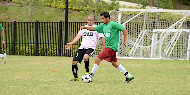Photo of an SIB Adult Soccer league playing soccer.