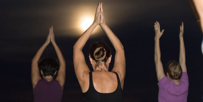 Sunny Isles Beach Yoga Teacher leads a class under the Full Supermoon