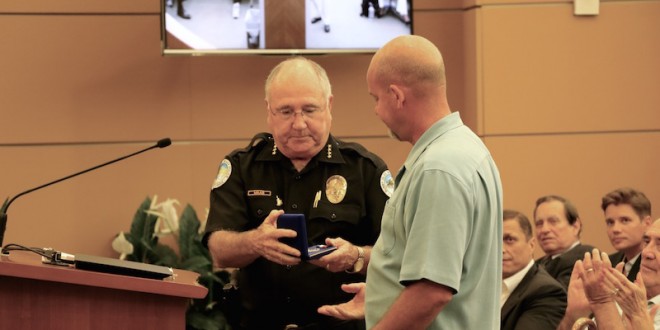 SIBPD Officer Mulvey receives life saving medal for rescue while off-duty.