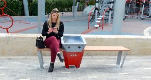 A photo of an SIB Resident using a soofa smart bench.