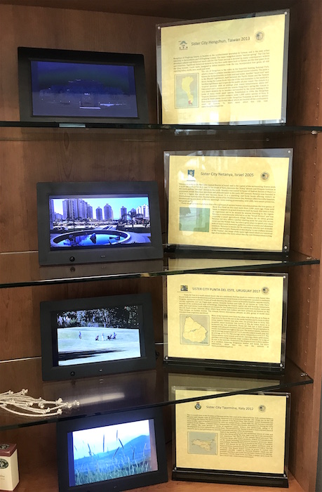Display in the Sunny Isles Beach Visitor Center featuring Electronic Picture frames cycling through photos of each Sister City. 
