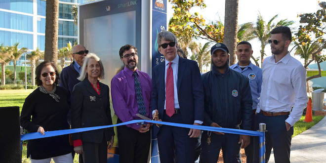 City Officials about to cut a ribbon at the Unveiling of the City's new Interactive Kiosk at Samson Oceanfront Park.