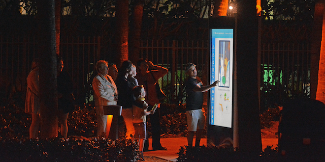 People using the interactive kiosk at Samson Park.