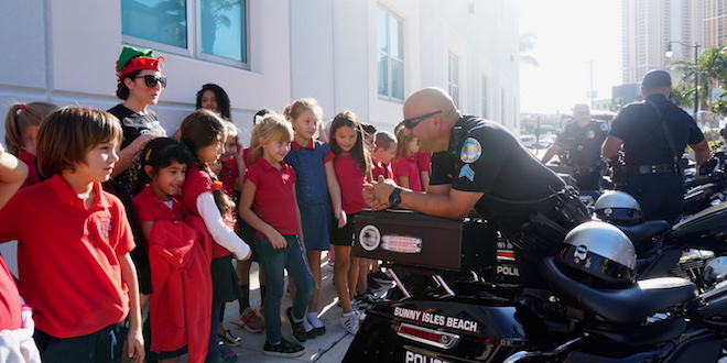 SIB Police Officer talked to students at Career Day.
