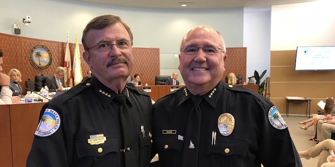 Police Chief Fred Maas and newly sworn-in Police Chief Dwight Snyder.