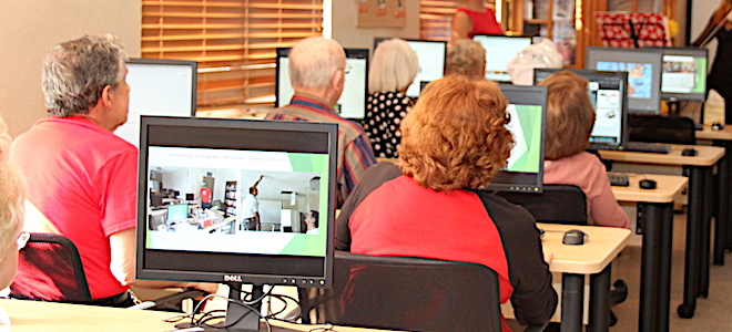 Marian Towers residents using computers donated by the City of Sunny Isles Beach.