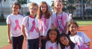 Kids grouped together for picture for Breast Cancer Awareness event