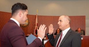 Commissioner Alex Lama is sworn in at Commissioner