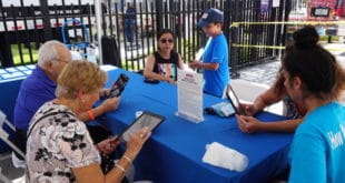 Residents participate in a media survey at the City's Anniversary Celebration
