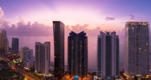 Sunny Isles Beach skyline with purple sunrise in the background