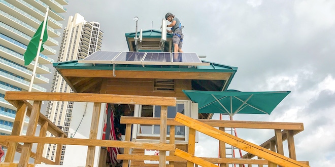 Information Technology Department adding solar-powered wi-fi panels to the lifeguard tower on the beach