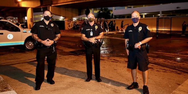 Police Officers at Halloween Event wearing facial coverings.